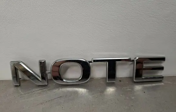Nissan Note (E11) Manufacturers badge/model letters 908951U600