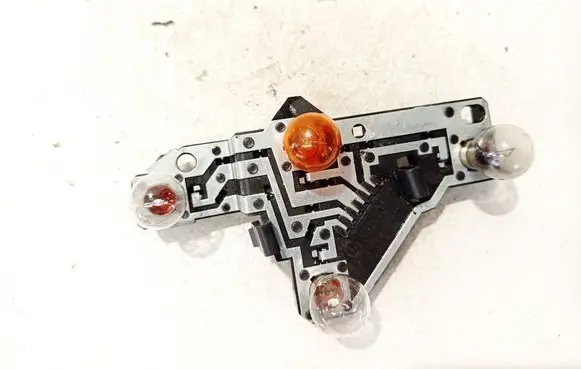 Tail light bulb cover holder