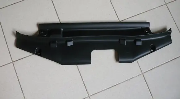 Engine bonnet/hood lock trim molding