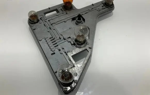 Tail light bulb cover holder