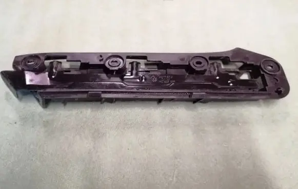 Volkswagen Touran I Front bumper mounting bracket 1T0807049