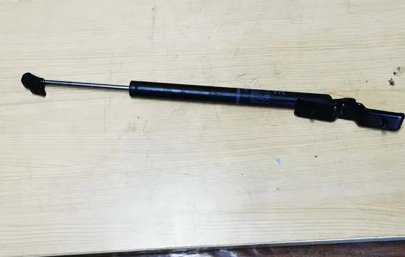 Front door check strap stopper