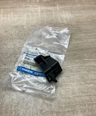Mazda 3 II Headlight/headlamp mounting bracket BHM150162