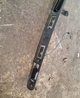 Trunk door license plate light bar
