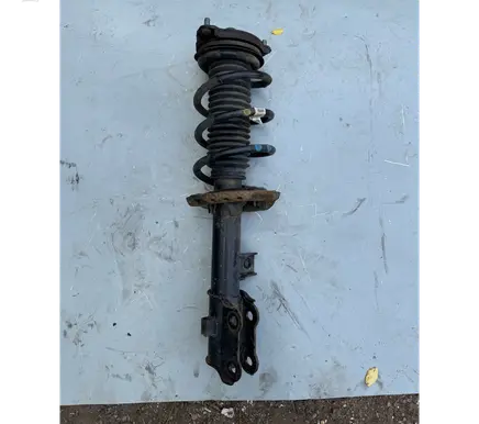 Front shock absorber with coil spring