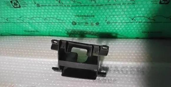 Volkswagen Touareg I Headlight washer nozzle holder 7L6807361