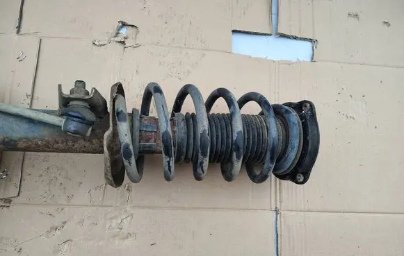 Volkswagen Caddy Front shock absorber with coil spring