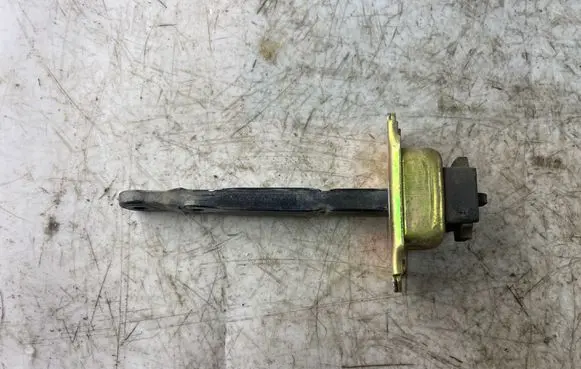 Front door check strap stopper