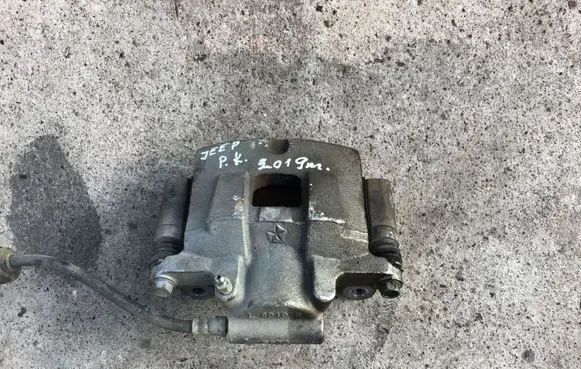 Jeep Cherokee Front brake caliper OEM