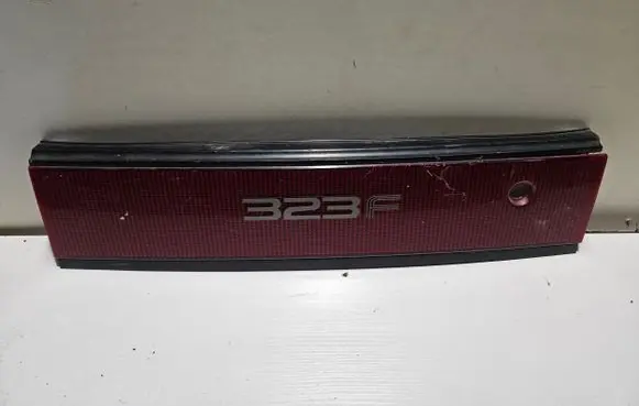 Mazda 323 F Rear light center trim bar blend 0674434
