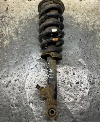 Mitsubishi L200 Front shock absorber with coil spring