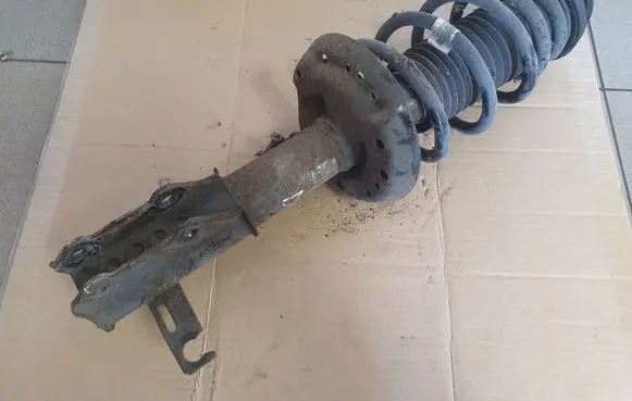 Opel Astra J Front shock absorber with coil spring 13354014