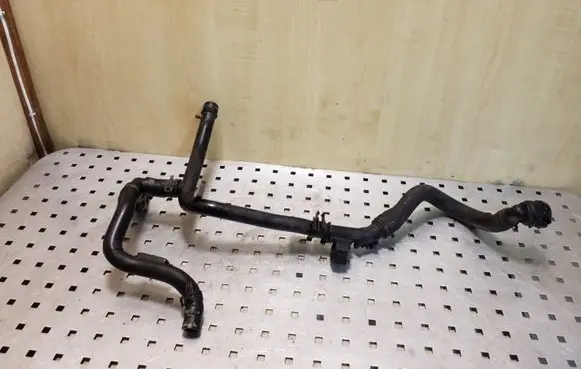 Volkswagen PASSAT B7 Engine coolant pipe/hose 03L121065AJ