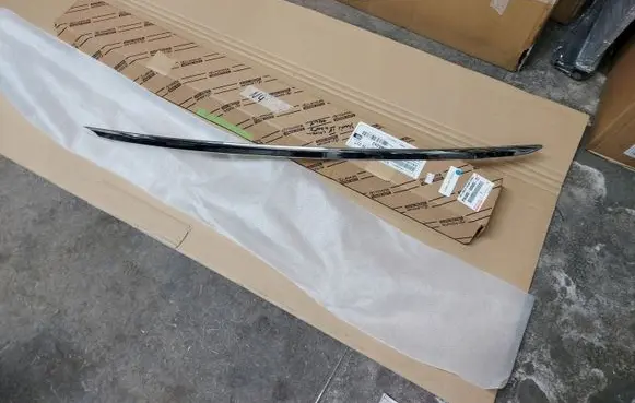 Toyota Yaris XP210 Trunk door license plate light bar PW4050D000