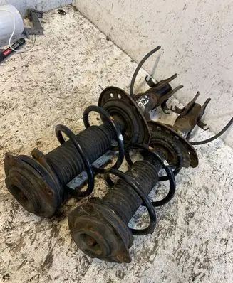 Nissan Juke I F15 Front shock absorber with coil spring