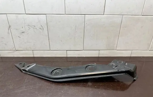 Radiator support slam panel bracket