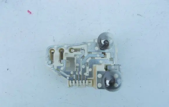 Tail light bulb cover holder