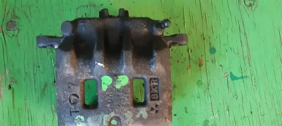 Subaru Forester SF Front brake caliper