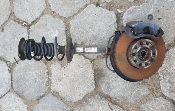 Front wheel hub spindle knuckle