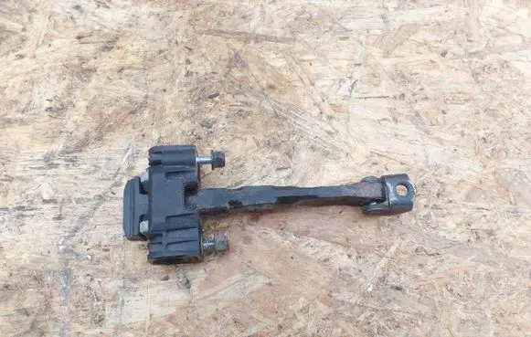 Front door check strap stopper