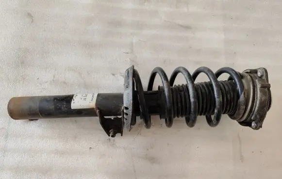 Volkswagen Caddy Front shock absorber with coil spring 31757