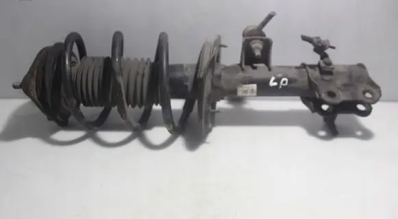 Front shock absorber with coil spring