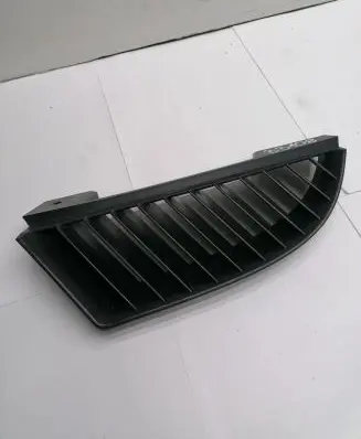 Mitsubishi Colt Front bumper upper radiator grill MN127773