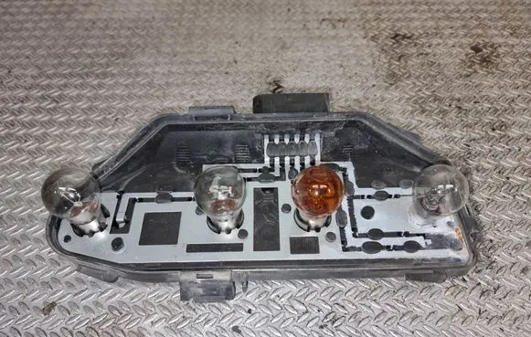 Tail light bulb cover holder