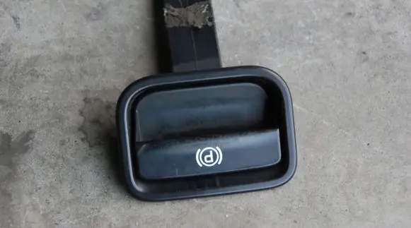 Porsche Cayenne (9PA) Hand brake release handle 7L5711814A