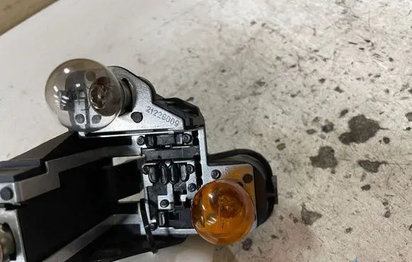 Volvo V40 Tail light bulb cover holder 31299833 21228009
