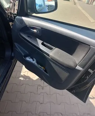 Suzuki SX4 Front door card panel trim