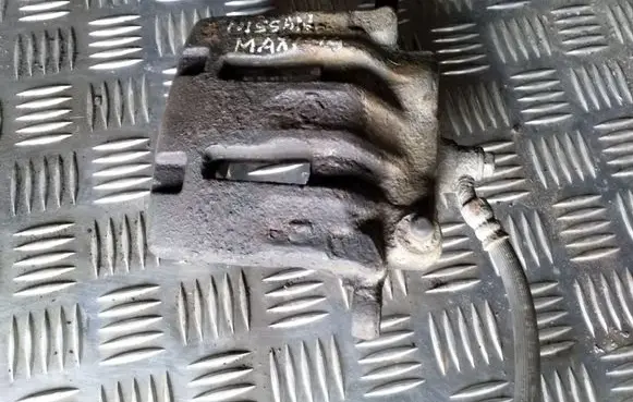 Nissan Maxima Front brake caliper