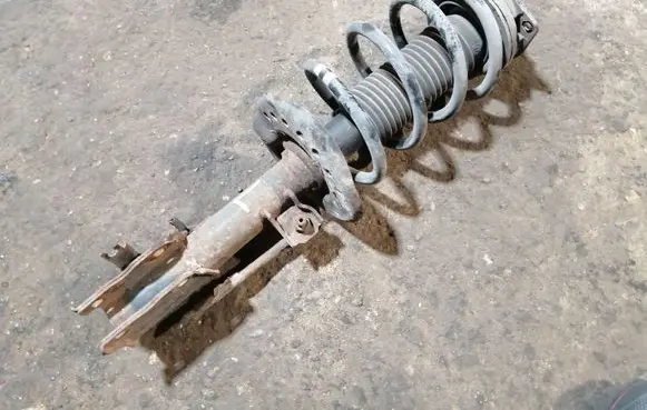 Nissan Qashqai Front shock absorber with coil spring