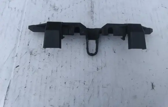 Engine bonnet/hood lock trim molding