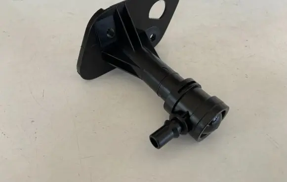 Headlight washer spray nozzle