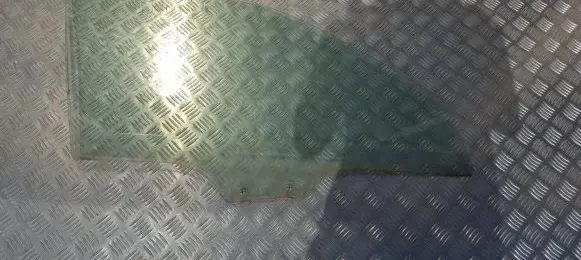 Mazda 323 F Front door window glass four-door