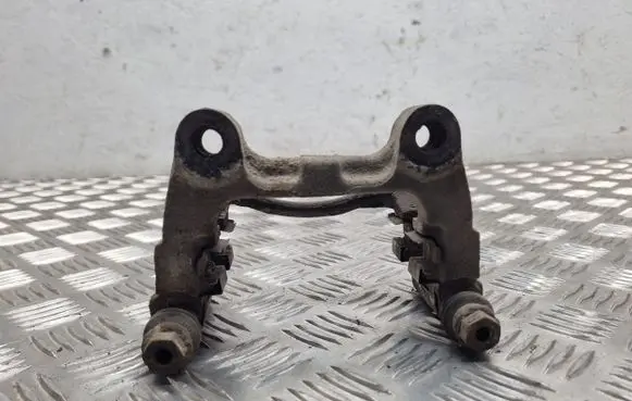 Volkswagen PASSAT B6 Brake caliper pad carrier rear 