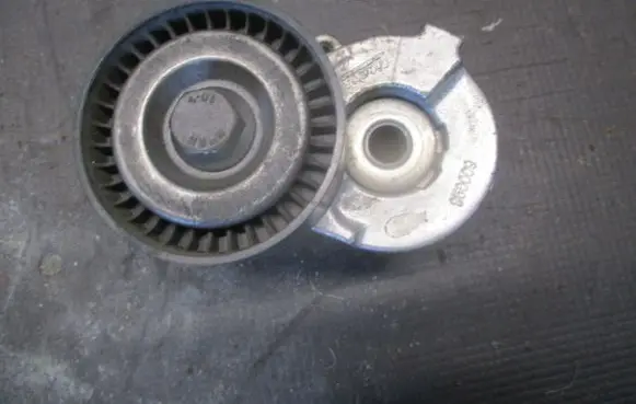 Opel Astra H Timing belt tensioner 
