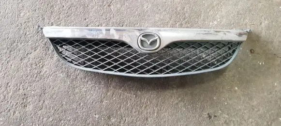 Mazda 626 Front bumper upper radiator grill