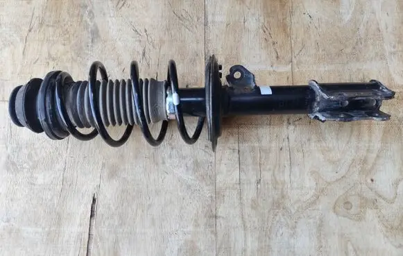 Toyota Yaris Front shock absorber with coil spring 485100D871