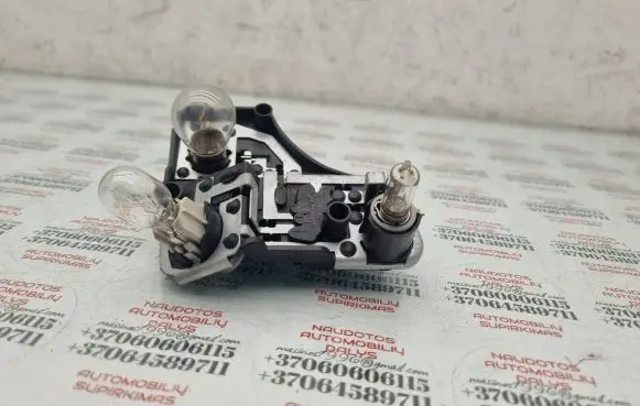 Tail light bulb cover holder