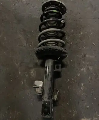 Front shock absorber with coil spring
