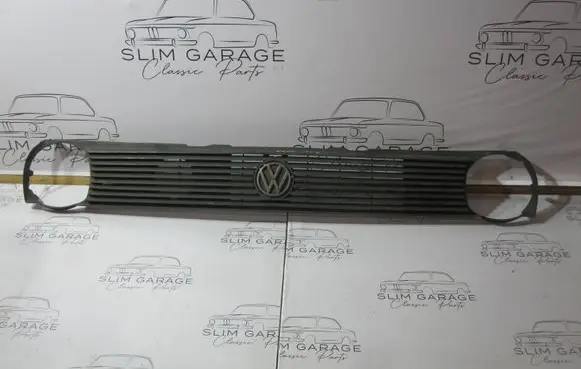 Volkswagen Polo II 86C 2F Front bumper upper radiator grill 867853653