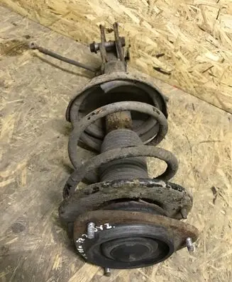 Subaru Outback Front shock absorber with coil spring