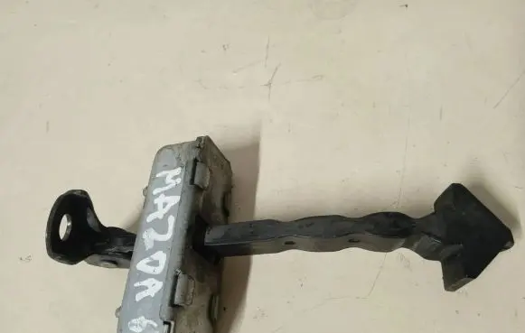 Mazda 6 Front door check strap stopper