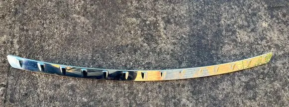 Rear bumper trim bar molding