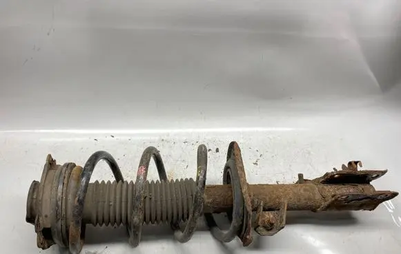 Nissan X-Trail T31 Front shock absorber with coil spring
