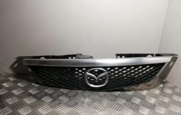 Mazda 323 Front bumper upper radiator grill