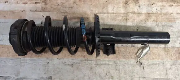 Volkswagen Fox Front shock absorber with coil spring GH354368