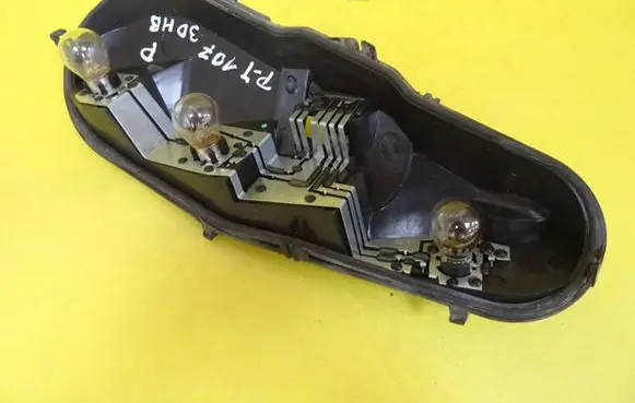 Tail light bulb cover holder